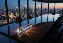 Goldman Sachs Names John Waldron as Successor to CEO David Solomon Conceptual image of a corporate baton on a boardroom table representing leadership transition.