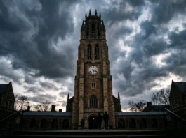 Cornell Fraternity Members Claim Consent as DA Reopens Sexual Assault Investigation A university clock tower at dusk under a dramatic sky.